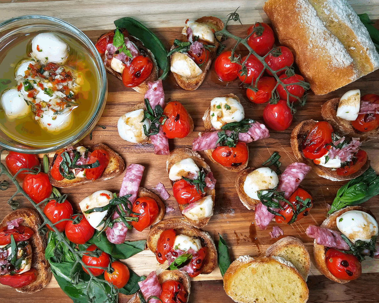 GRO-July Recipe Blog Banner Blistered Tomato Bruschetta Bites with olive oil and mozzarella and crostini